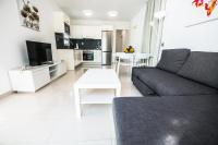 Telewizja i/lub zestaw kina domowego w obiekcie Bahia Calma Beach