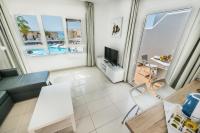 Telewizja i/lub zestaw kina domowego w obiekcie Bahia Calma Beach