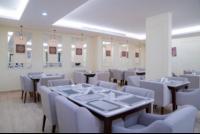 a dining room with white tables and white chairs at فندق براي Brai Hotel in Ad Dawādimī