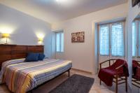 A bed or beds in a room at La Tela di Penelope