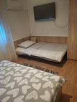 Posteľ alebo postele v izbe v ubytovaní Apartman Centros