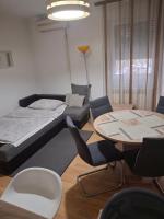 Posteľ alebo postele v izbe v ubytovaní Apartman Centros