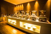 a display of plates and bowls on a table in a store at Echarm Hotel - Jingmen Yintai City Jingchu Institute of Technology in Jingmen