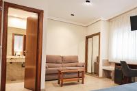 A seating area at Hotel Ciudad de Compostela