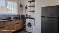 Kuchyň nebo kuchyňský kout v ubytování Beach apartment's