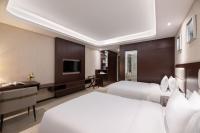 ShangHai LuAn Garden Hotelにあるベッド