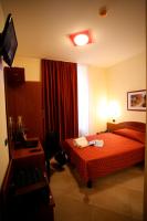 A bed or beds in a room at Hotel Della Volta