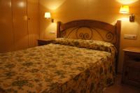 Postel nebo postele na pokoji v ubytování Apartamentos Fidalgo