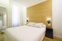 A bed or beds in a room at Valencia Luxury - Boutique Redonda