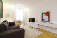A television and/or entertainment centre at Valencia Luxury - Boutique Redonda