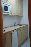 Kuchyň nebo kuchyňský kout v ubytování Apartamentos Fidalgo