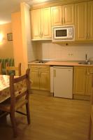 Kuchyň nebo kuchyňský kout v ubytování Apartamentos Fidalgo