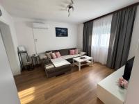Televízia a/alebo spoločenská miestnosť v ubytovaní Apartman Rukavina