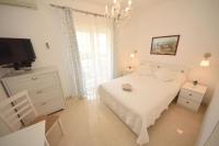 Posteľ alebo postele v izbe v ubytovaní Apartments Lucky