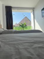 Postel nebo postele na pokoji v ubytování Sola Pyramids inn