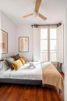 A bed or beds in a room at Ronda Sant Pere Private City Center 3Bedroom Suite C