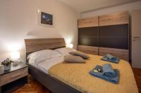 Postel nebo postele na pokoji v ubytování Apartman Maria