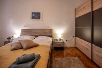 Postel nebo postele na pokoji v ubytování Apartman Maria