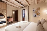 Posteľ alebo postele v izbe v ubytovaní Philikon Luxury Suites
