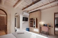 Posteľ alebo postele v izbe v ubytovaní Philikon Luxury Suites