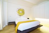 A bed or beds in a room at Valencia Luxury - Boutique Redonda