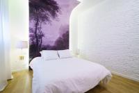 A bed or beds in a room at Valencia Luxury - Boutique Redonda