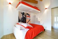 A bed or beds in a room at Valencia Luxury - Boutique Redonda