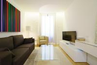 A television and/or entertainment centre at Valencia Luxury - Boutique Redonda