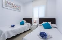 Posteľ alebo postele v izbe v ubytovaní Centrico Playa Caleta 3 dormitorios