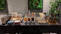 a black table with plates and bottles and drinks on it at HOTEL SUI AKASAKA by ABEST in Tokyo