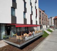 a restaurant with tables and chairs in front of a building at Clarion Congress Hotel Olomouc in Olomouc