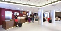 a group of people standing in a lobby with luggage at Clarion Congress Hotel Olomouc in Olomouc
