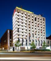 a tall white building with a sign on it at Clarion Congress Hotel Olomouc in Olomouc