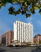 a white building in a city with buildings at Clarion Congress Hotel Olomouc in Olomouc
