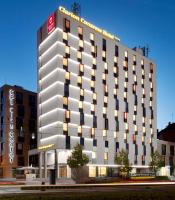 a large white building with a red sign on it at Clarion Congress Hotel Olomouc in Olomouc