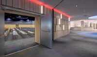 a room with chairs and a door with red lights at Clarion Congress Hotel Olomouc in Olomouc