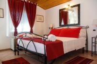 A bed or beds in a room at VILLA GIUMMARITO B&B