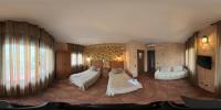 A bed or beds in a room at Posada de los Cónsules
