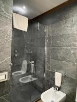 a bathroom with a shower and a toilet and a sink at Villa Spalletti Trivelli - Small Luxury Hotels of the World in Rome