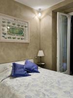 a bedroom with a bed with blue pillows on it at Villa Spalletti Trivelli - Small Luxury Hotels of the World in Rome