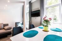 Televízia a/alebo spoločenská miestnosť v ubytovaní BpR Szondi Cozy Apartment