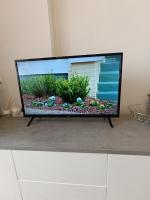A television and/or entertainment centre at Apartamento MIRAMAR