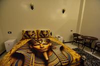 Postel nebo postele na pokoji v ubytování Luxor Sapphire