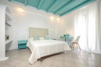 Posteľ alebo postele v izbe v ubytovaní Naxos Evilion Luxury Apartments & Suites