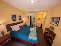 A bed or beds in a room at Waterside Inn