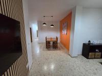 Televízia a/alebo spoločenská miestnosť v ubytovaní Apartamentos Casa Sardina