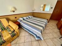 A bed or beds in a room at Hotel Ca' Bianca da Paolino