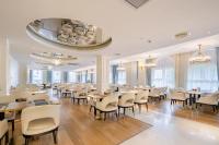 a dining room filled with tables and chairs at NARADA Resort Shanghai Hotel Disney Store in Zhuqiao