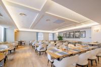 a dining room with tables and chairs at NARADA Resort Shanghai Hotel Disney Store in Zhuqiao