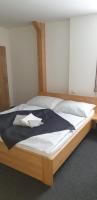 Postel nebo postele na pokoji v ubytování Penzion a Restaurace u Sousedů